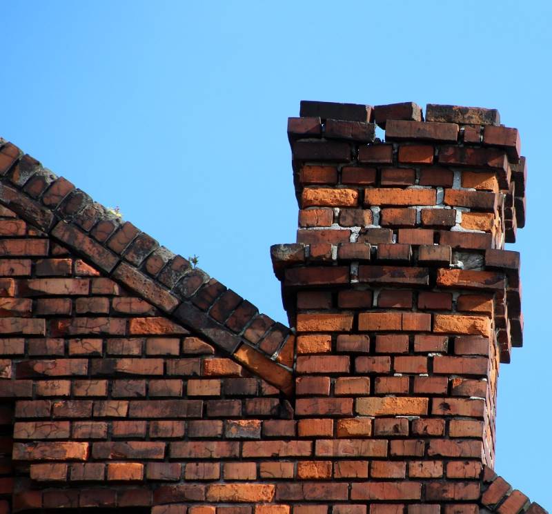 Damaged chimney on an Century City home showing cracks and missing mortar